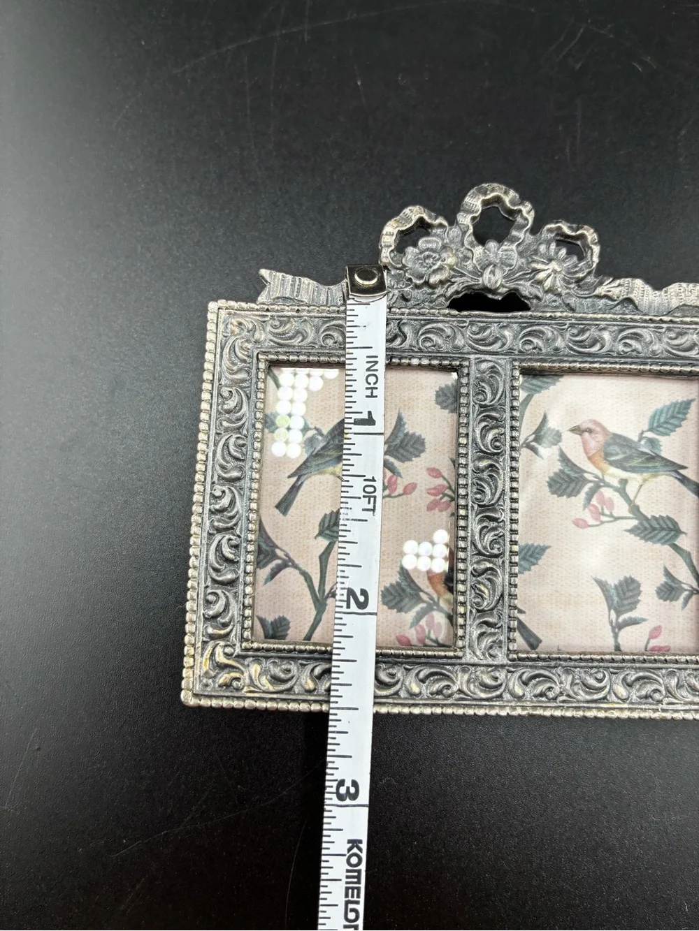 Ornate pewter Double Photo Frame with floral bow on top